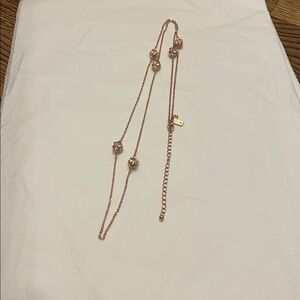 Kate Spade Rose Gold Toned Knot Necklace with Crystal Accents